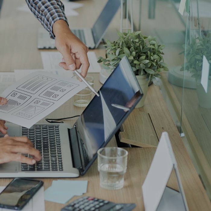 web development team discussing project ideas in an office setting
